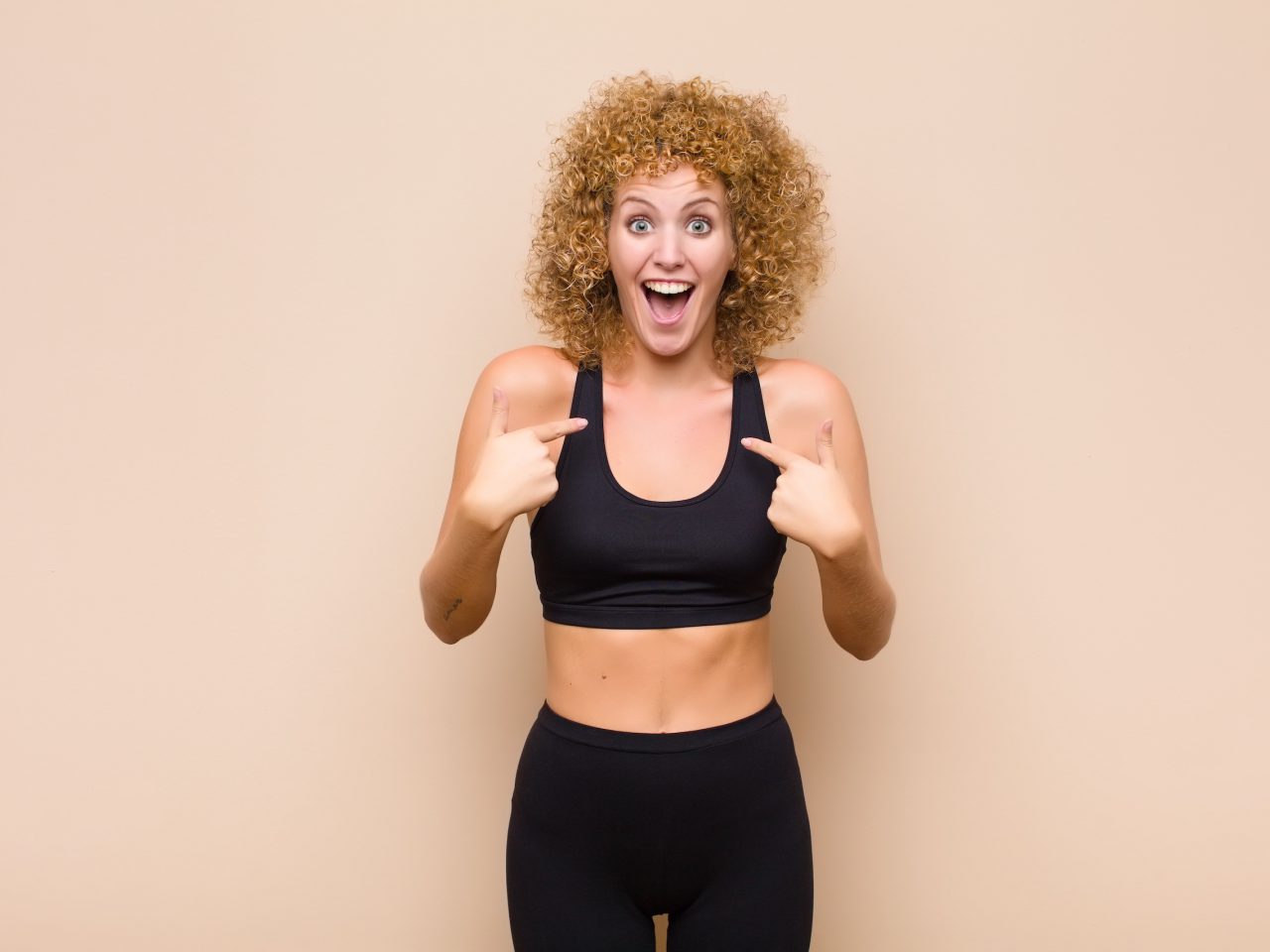 feeling happy, surprised and proud, pointing to self with an excited, amazed look